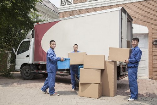 Man and van loading furniture near a Highbury residential street