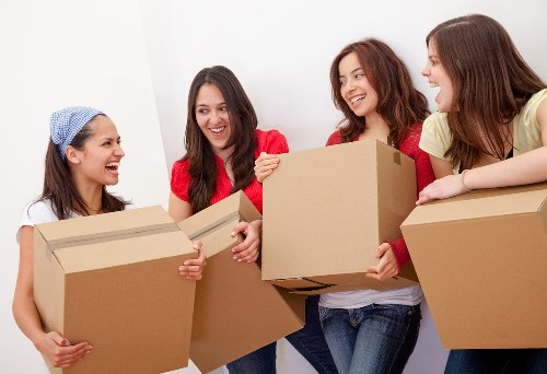 Careful lifting of furniture in a Highbury flat move