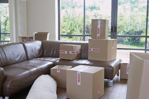 Moving van loading boxes and furniture for a Highbury home relocation